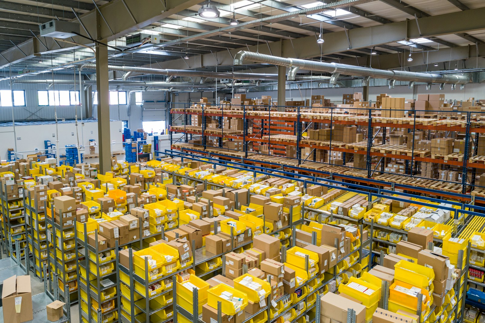 Organised warehouse distribution centre with racking and containers
